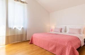 Postel nebo postele na pokoji v ubytování Apartments Villa Maja