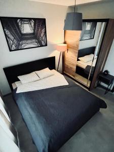 Cama o camas de una habitación en Apartament Husarska
