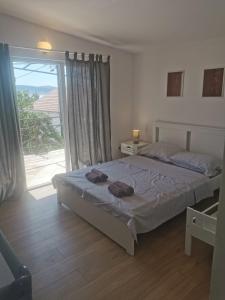 Postel nebo postele na pokoji v ubytování Mini House Mara