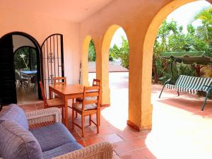 a patio with a table and chairs in a house at Casa MiraMar seaview BBQ pool 250m from beach in Calpe