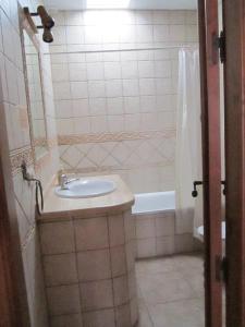 a bathroom with a sink and a bath tub at Casa Ana, Fantásticas vistas a Frigiliana, el mar y la montaña in Frigiliana