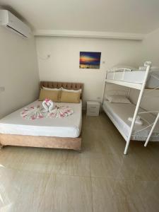 Postel nebo postele na pokoji v ubytování Villa Mateo