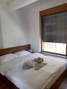 A bed or beds in a room at Avram