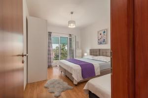 Ein Bett oder Betten in einem Zimmer der Unterkunft Apartments Fani