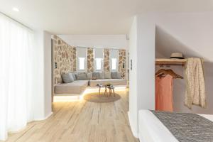 Postel nebo postele na pokoji v ubytování Naxian Spirit Inn
