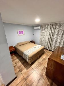 A bed or beds in a room at ARASARÍ Hotel Iguazú