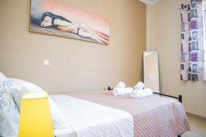Postel nebo postele na pokoji v ubytování Kalamata Alex Apartments