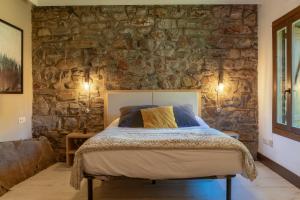 Tempat tidur dalam kamar di La Borda de Chelis