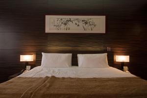 Кровать или кровати в номере International Hotel Sayen