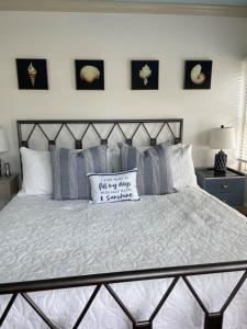a bedroom with a large bed with a pillow on it at The Tern Inn Bed & Breakfast and Cottages in West Harwich