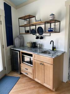 a kitchen with a sink and a counter at The Tern Inn Bed & Breakfast and Cottages in West Harwich