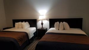 Postel nebo postele na pokoji v ubytování Valley Hi Hotel