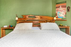 Postel nebo postele na pokoji v ubytování Villas Oasis