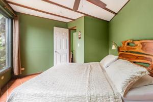 Postel nebo postele na pokoji v ubytování Villas Oasis