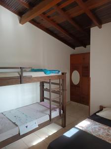 a bedroom with two bunk beds and a table at Hermoso apartamento duplex en el centro histórico de San Gil, 5 in San Gil
