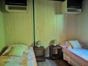 Ένα ή περισσότερα κρεβάτια σε δωμάτιο στο Les Agapanthes