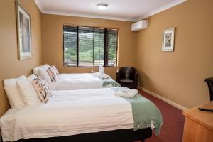 Postel nebo postele na pokoji v ubytování Kendenup Cottages and Lodge + 111 fotografií