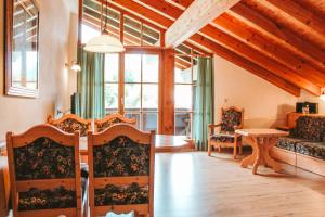 a living room with a couch and a table at Kaiserhof in Reit im Winkl