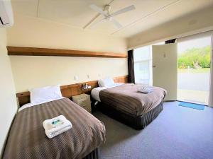מיטה או מיטות בחדר ב-The Terang Motor Inn