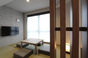 TV a/nebo společenská místnost v ubytování KOKO HOTEL Residence Asakusa Tawaramachi