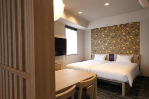 Postel nebo postele na pokoji v ubytování KOKO HOTEL Residence Asakusa Tawaramachi