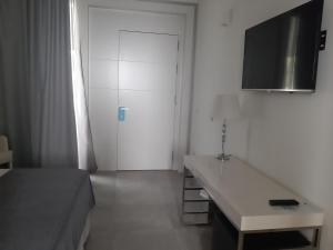 TV a/nebo společenská místnost v ubytování Hotel Atlántico