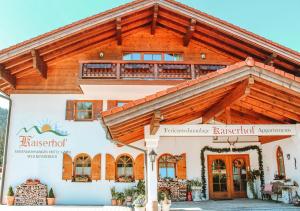 a building with a wooden roof at Kaiserhof in Reit im Winkl