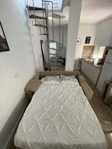 Posteľ alebo postele v izbe v ubytovaní Atico duplex con Terraza en pleno centro de Jerez