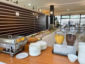 a buffet line with plates and food in a restaurant at OW Jaroszowiec in Łazy