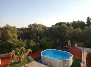 an overhead view of a swimming pool in a backyard at Le dimore di Flora Charme in Monopoli