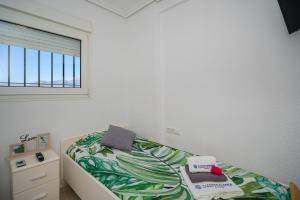 Postel nebo postele na pokoji v ubytování Apartment 3d Albir
