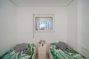 Postel nebo postele na pokoji v ubytování Apartment 3d Albir + 16 fotografií