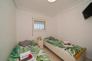 Postel nebo postele na pokoji v ubytování Apartment 3d Albir