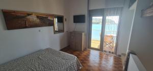 Postel nebo postele na pokoji v ubytování Haraki House