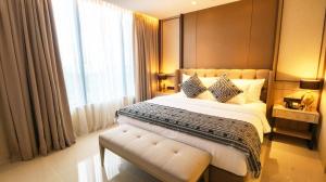 Postel nebo postele na pokoji v ubytování Prime Park Hotel & Convention Lombok