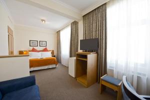 Hotel Thuringerhof tesisinde bir odada yatak veya yataklar
