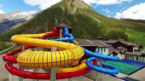 a water slide in front of a mountain at Chalet Pizabela Bait da Pizabela in Livigno