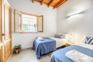 Posteľ alebo postele v izbe v ubytovaní Villa Can Rafalet + 26 fotografií
