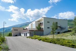 a house on the side of a road at Gaya Residences in Shahdag