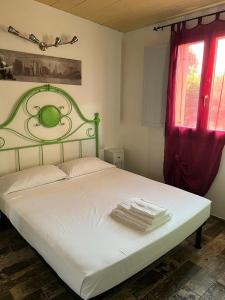 En eller flere senge i et værelse på La Perpetua