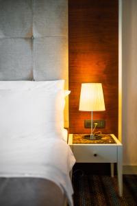 Postel nebo postele na pokoji v ubytování CRYSTAL Hotel Belgrade