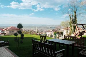 a patio with a table and benches and a playground at Kartepe LOFT in Kocaeli