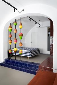 a room with a bed with colorful lights at BLU - Apulian Suite in Bari