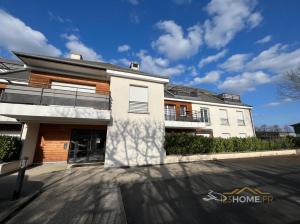 a white building with a street in front of it at 123home- Garden & Spa in Serris