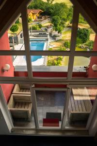 a view from the inside of a building with a window at All Senses Ferienwohnung in Hirschbach