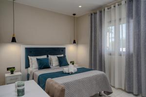 Ένα ή περισσότερα κρεβάτια σε δωμάτιο στο Blue Wind Villa II +27 φωτογραφίες