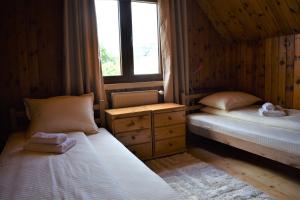 Posteľ alebo postele v izbe v ubytovaní Srna Chalet - Rooms