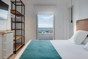 Posteľ alebo postele v izbe v ubytovaní Zinemaldi Suite by FeelFree Rentals