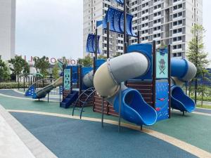 a playground with a slide in a park at Horizon Suite Homestay, KLIA by S&T Homez in Sepang