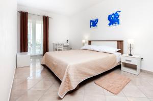 Postel nebo postele na pokoji v ubytování Apartments Vinko